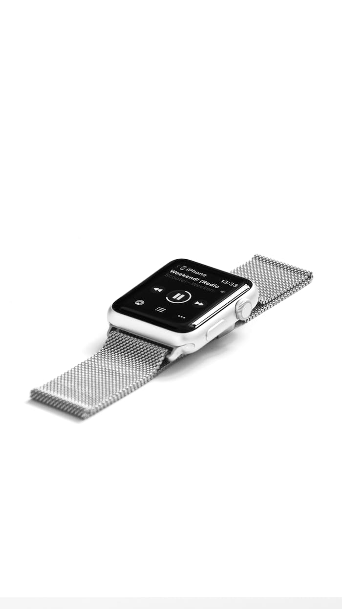 about-us Modern smartwatch with sleek metal band displayed on white background.